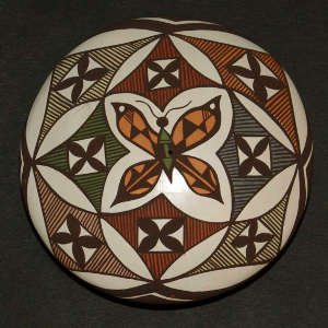 Parrot and geometric design on a polychrome seed pot