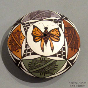 Butterfly and geometric design on a polychrome seedpot