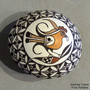 Parrot and geometric design on a polychrome seed pot