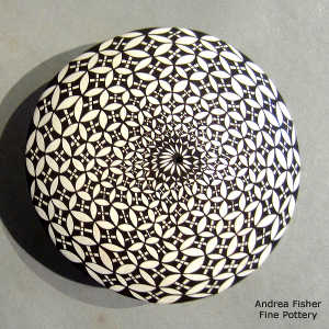 Geometric design on a black and white seed pot