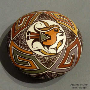 Parrot, fine line and geometric design pn a polychrome seed pot