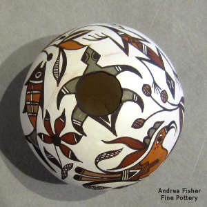 Lizard, turtle, branch, parrot and geometric design on a polychrome seed pot
