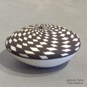 Geometric design on a black and white seed pot
