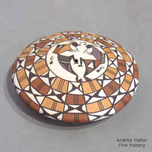Kokopelli and geometric design on a polychrome seed pot