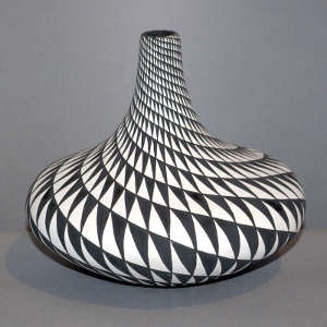 Spiral geometric design on a black and white jar