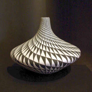 Spiral mesa design on a tall neck black and white jar