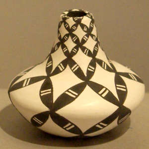 Geometric design on a tall neck black and white jar