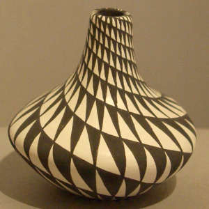 Spiral mesa design on a tall neck black and white jar