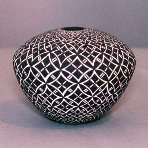 Geometric design on a black and white jar