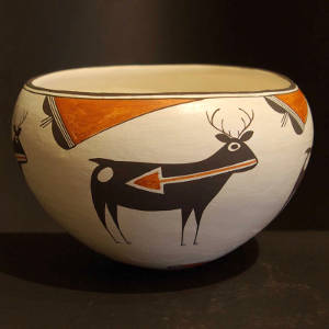 Deer, heart line and thundercloud design on a polychrome jar