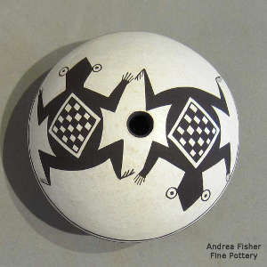 Mimbres frog and geometric design on a black-on-white seed pot