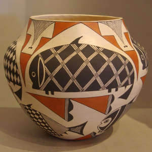 Stylized Mimbres fish and traditional designs on a polychrome jar