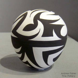 Geometric design decorating a black and white seedpot