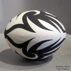 Tattoo geometric design on a black and white seed pot