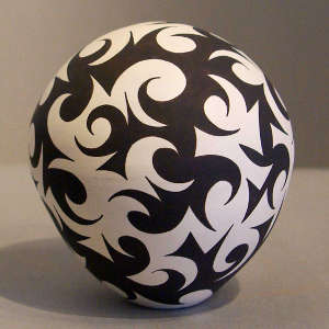 Tattoo geometric design on a black and white seed pot