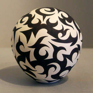 Tattoo geometric design on a black and white seed pot