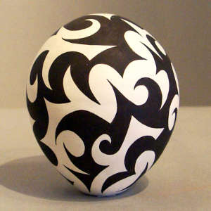 Tattoo geometric design on a black and white seed pot