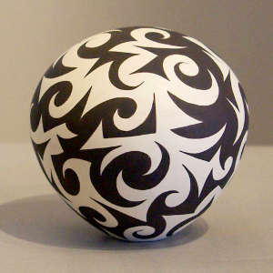Tattoo geometric design on a black and white seed pot