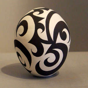 Geometric tattoo design on a black and white seedpot