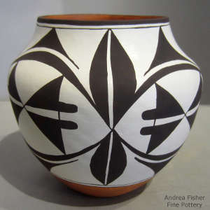 Black and white geometric design on a polychrome jar