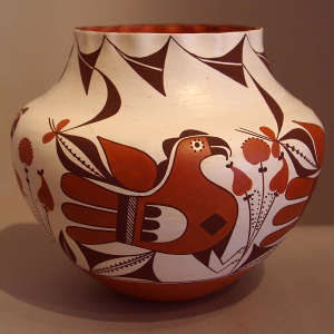 Parrot, plant and geometric design on a polychrome jar with a pie crust rim