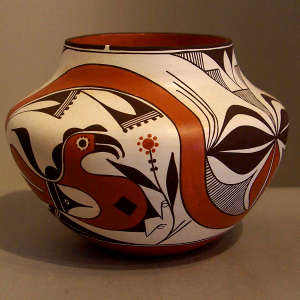 Parrot, rainbow, branch and geometric design on a polychrome jar