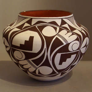 Black and white medallion, bird element and geometric design on a polychrome jar