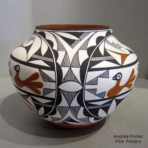 Bird and geometric design on a polychrome jar