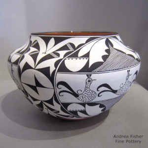 Bird, rain and geometric design on a polychrome jar