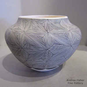 Snowflake fine line and geometric design on a black and white jar