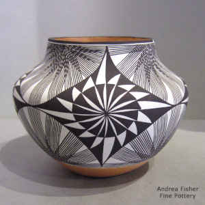 Fine line and geometric design on a polychrome jar