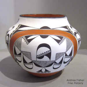 Fine line, rainbow and geometric design on a polychrome jar