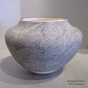 Snowflake fine line design on a black and white jar