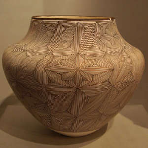 Fine line design on a black and white jar