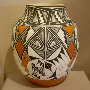 Feather, bird element, fine line and geometric design on a polychrome jar