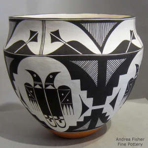 Black and white bird element and geometric design on a polychrome jar