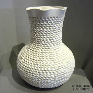 Corrugation on a tall neck white jar