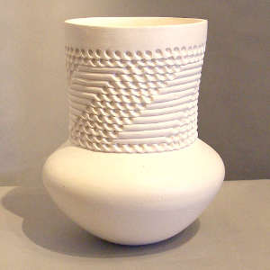Tall corrugated neck on a white jar