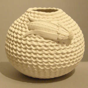 Ear of corn relief on a corrugated white jar