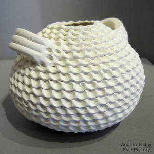 Corrugated surface on a white jar with handles