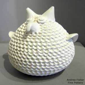 Corrugated surface on a white owl effigy