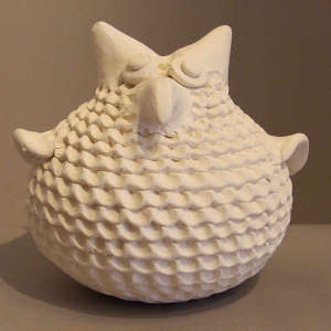 White owl with a corrugated surface