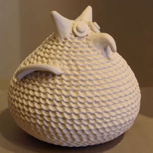 Corrugated surface on a white owl effigy