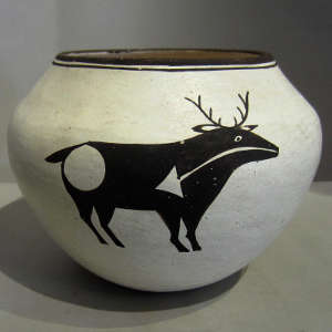 Deer and heart line design on a black and white jar