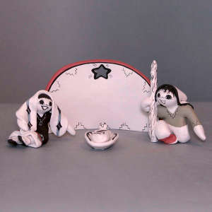 Nativity set with four pieces including a wall