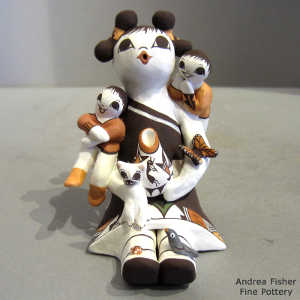 Two children, a cat and a butterfly on a female storyteller