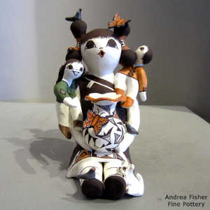 Two children, pot, bird, cat and butterflies on a storyteller