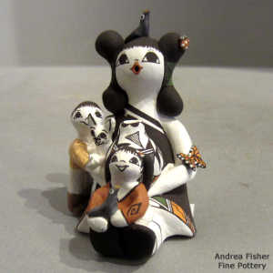 2 children, butterfly, birds, lady bug and a cat on a storyteller