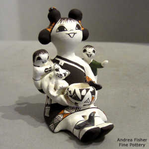 2 children, butterfly, bird, lady bug and a kitten on a storyteller