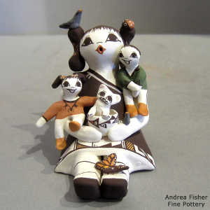 Two children, bird, cat, butterfly and lady bug on a storyteller